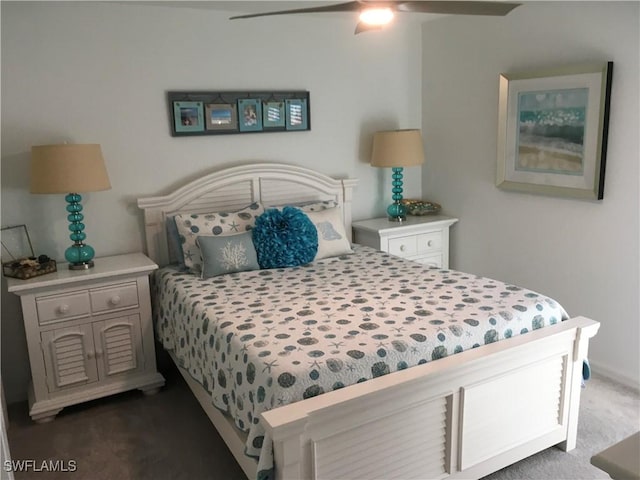 bedroom featuring ceiling fan and dark colored carpet