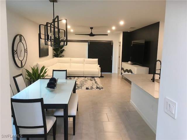 dining room with baseboards, a ceiling fan, and recessed lighting