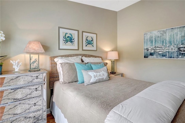 bedroom with hardwood / wood-style flooring