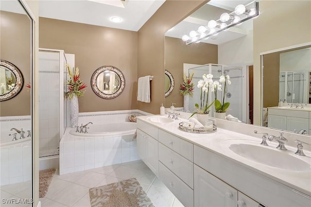 bathroom featuring tile patterned floors, vanity, and plus walk in shower