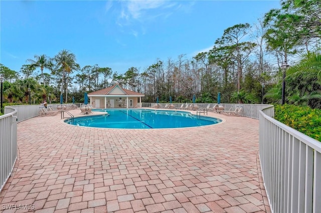 view of swimming pool featuring a patio