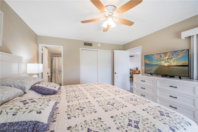 bedroom featuring a closet, ceiling fan, and ensuite bathroom