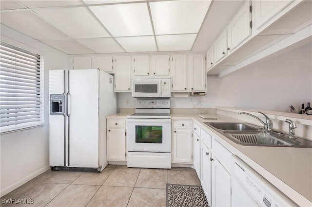 kitchen featuring white cabinetry, white appliances, and sink