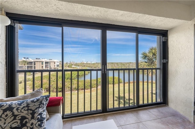 unfurnished sunroom with a water view