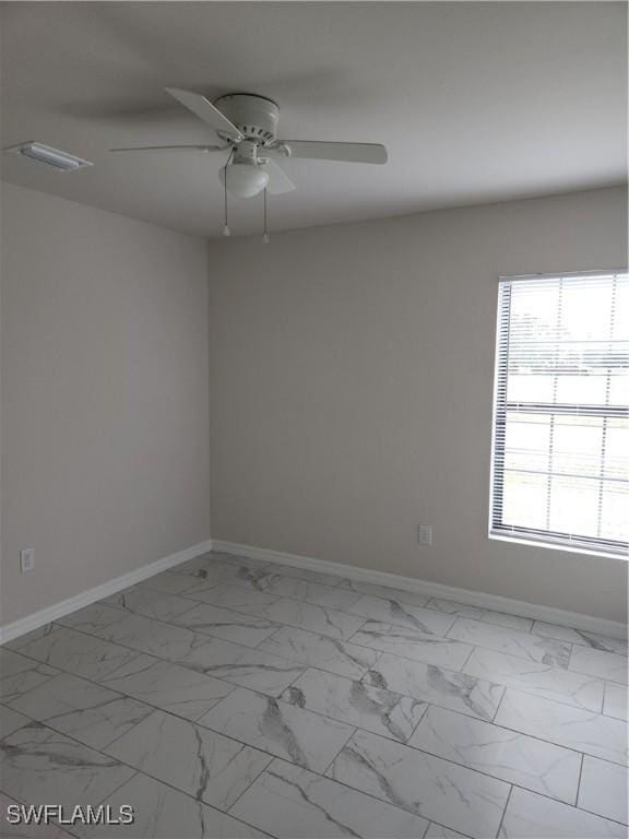 unfurnished room featuring ceiling fan