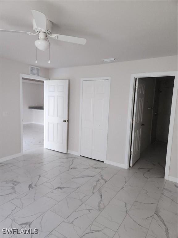 unfurnished bedroom featuring ceiling fan