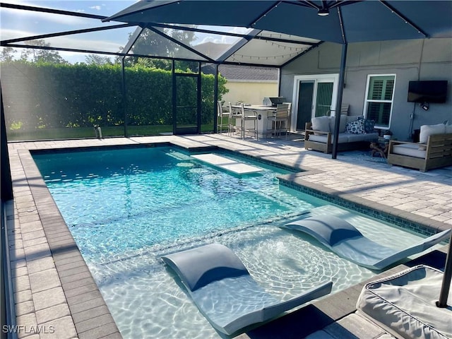 view of swimming pool with a patio area, an outdoor bar, an outdoor hangout area, and exterior kitchen