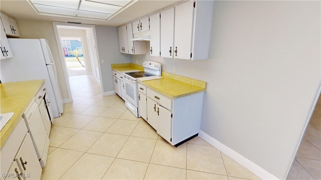 kitchen featuring white cabinets, white appliances, and light tile patterned floors