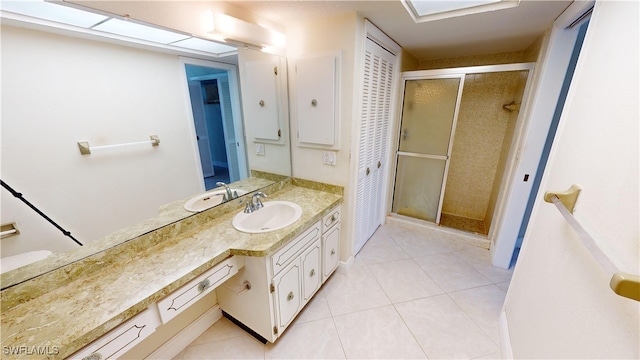 bathroom featuring vanity, tile patterned floors, and an enclosed shower