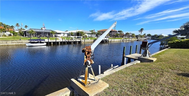 dock area featuring a yard and a water view