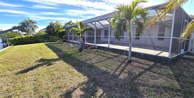 view of yard featuring glass enclosure