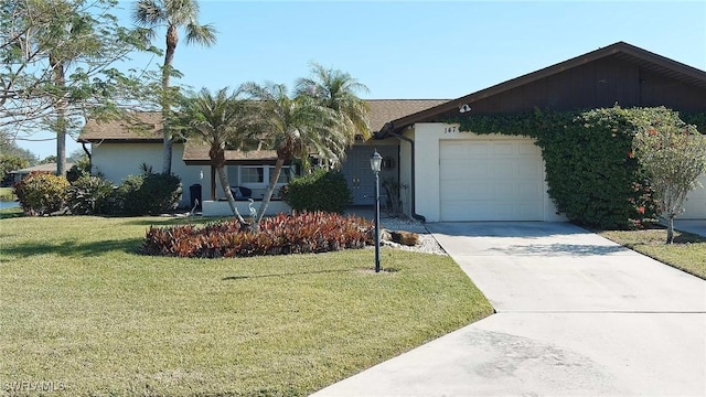 ranch-style house with a garage and a front lawn