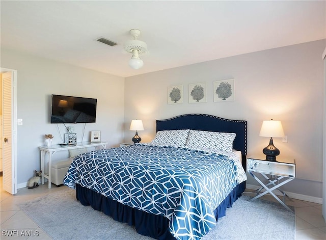 bedroom featuring tile patterned floors and ceiling fan