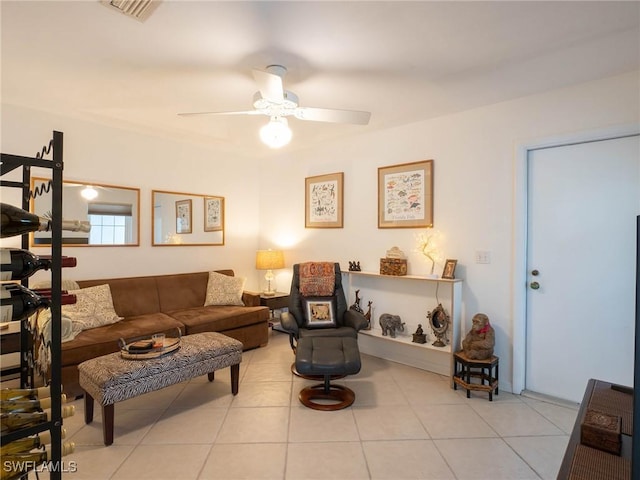 living room featuring ceiling fan and light tile patterned floors