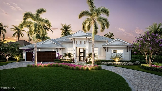 541 106th Ave N, Naples, FL 34108 - view of front of property with a lawn, an attached garage, decorative driveway, and board and batten siding