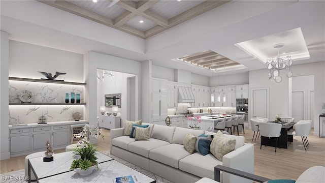 living room featuring coffered ceiling, a high ceiling, light hardwood / wood-style floors, and beam ceiling