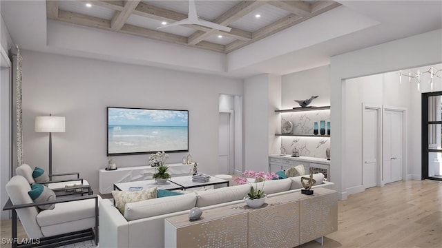 living room with a high ceiling, light hardwood / wood-style flooring, coffered ceiling, and beamed ceiling