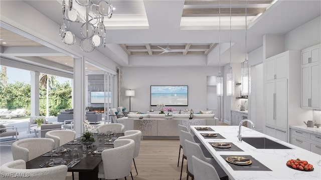 kitchen with light hardwood / wood-style flooring, beam ceiling, white cabinetry, coffered ceiling, and sink