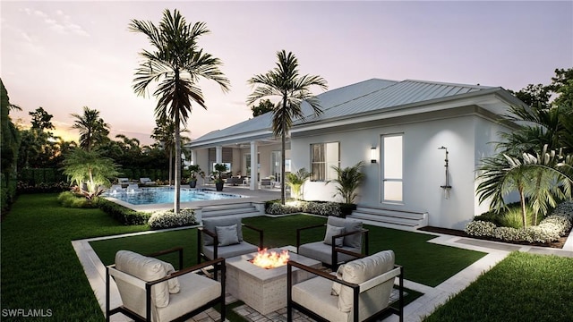541 106th Ave N, Naples, FL 34108 - rear view of property featuring an outdoor living space with a fire pit, entry steps, a yard, a patio area, and an outdoor pool