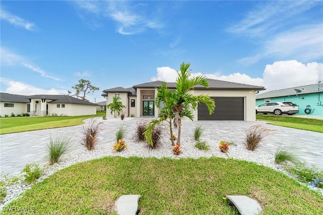 view of front of property with a front yard and a garage