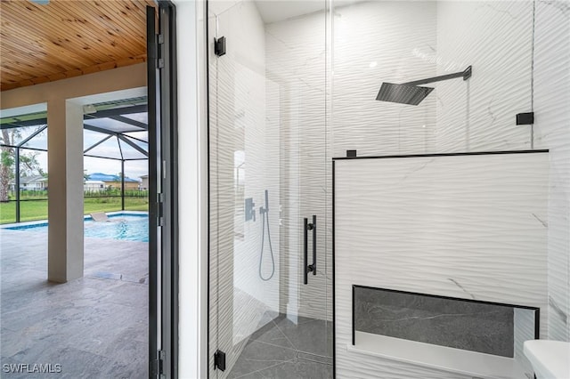 bathroom with wooden ceiling and a shower with shower door