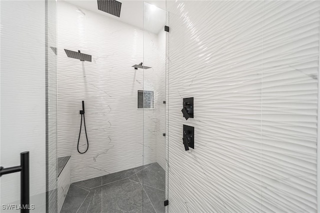 bathroom with a tile shower