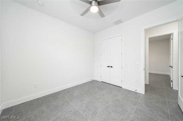 unfurnished bedroom with a closet and ceiling fan