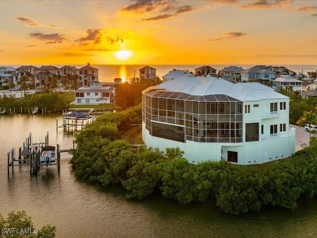 5801 Cape Hickory Ct, Bonita Springs, FL 34134 - aerial view at dusk of a residential view and a water view