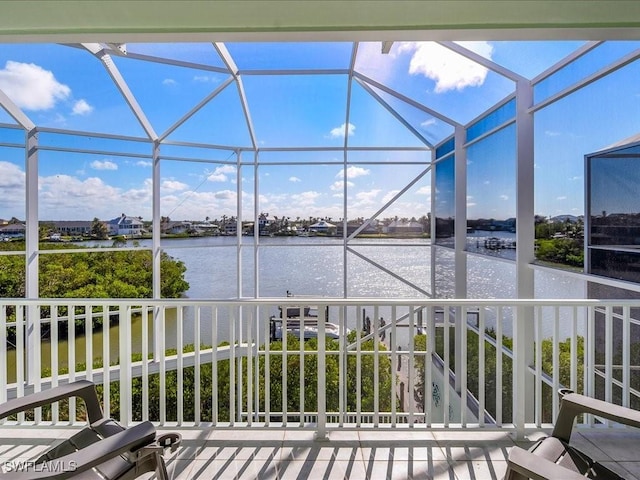 unfurnished sunroom with a water view