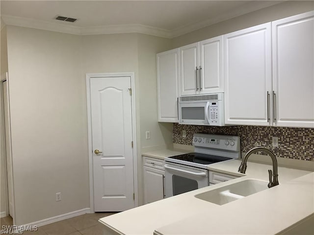 kitchen with white cabinetry, white appliances, sink, and ornamental molding