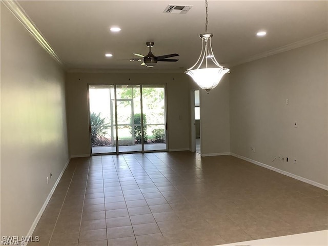 tiled spare room featuring ceiling fan and crown molding