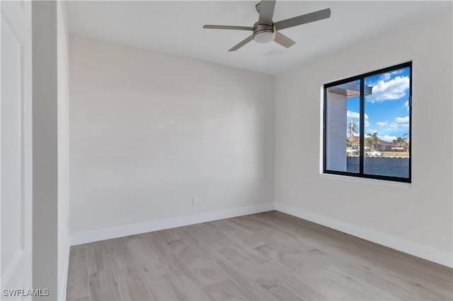 unfurnished room featuring ceiling fan and light wood-type flooring