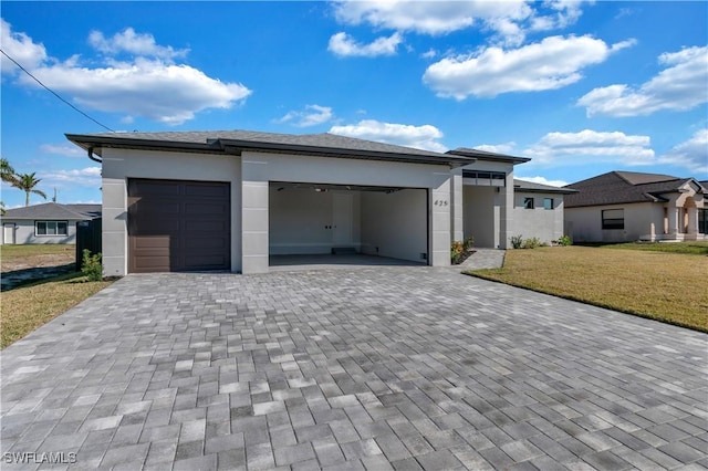 garage featuring a lawn