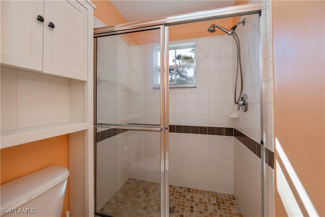 bathroom with walk in shower and toilet