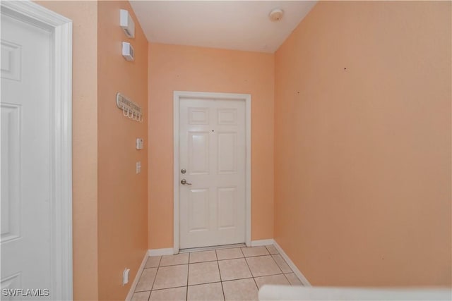 entryway with light tile patterned floors