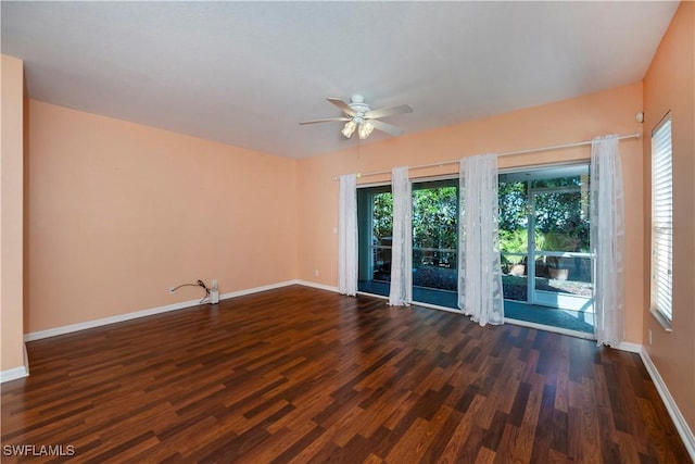 empty room featuring ceiling fan and dark hardwood / wood-style floors