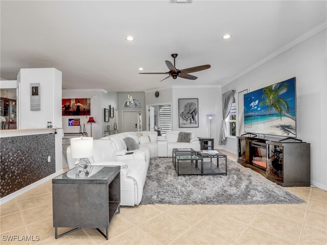 living area with tile patterned flooring, recessed lighting, and crown molding