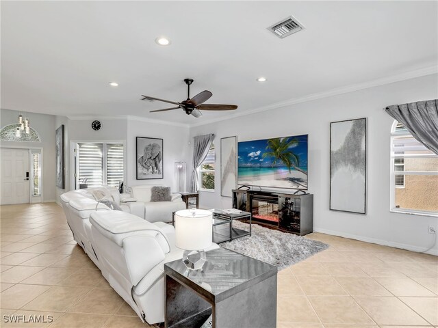 living room featuring visible vents, crown molding, baseboards, recessed lighting, and light tile patterned flooring