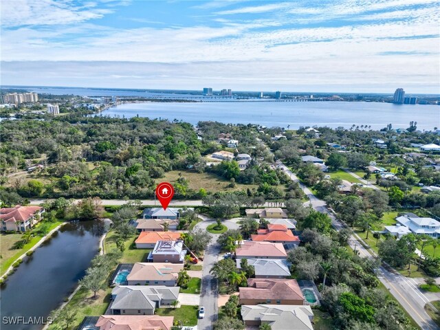 bird's eye view with a water view and a residential view