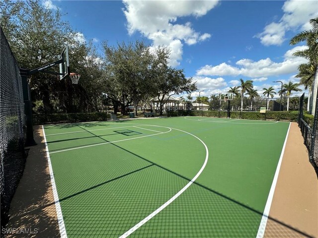 view of sport court featuring community basketball court and fence