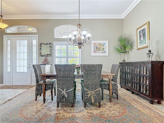 dining area featuring an inviting chandelier and ornamental molding