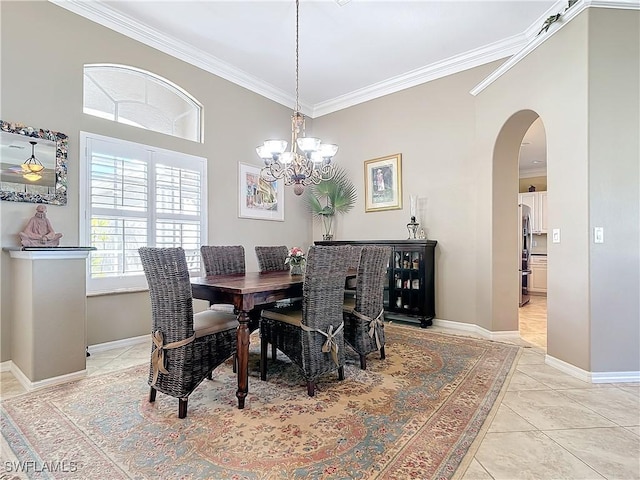 tiled dining space with ornamental molding and an inviting chandelier