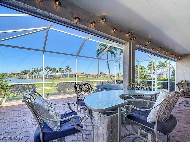 view of patio featuring glass enclosure