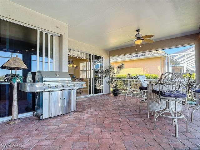 view of patio featuring ceiling fan and grilling area