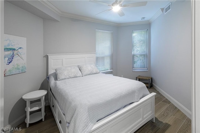 bedroom with ceiling fan and ornamental molding