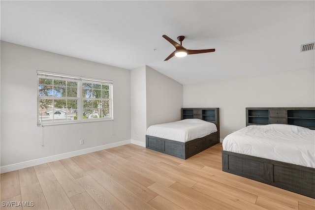 bedroom with ceiling fan and light wood-type flooring