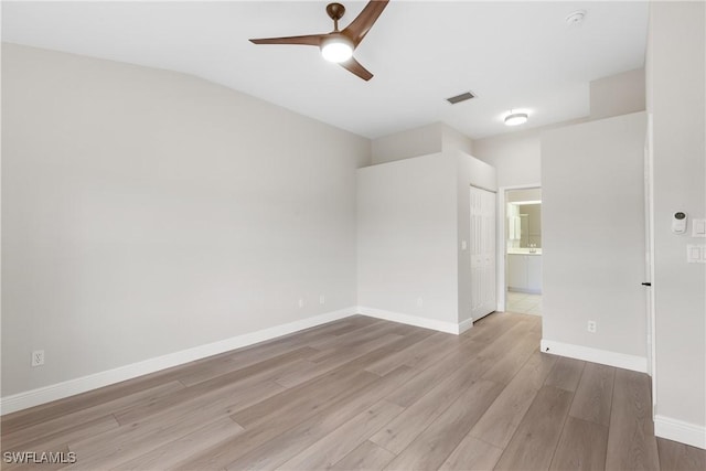 spare room featuring ceiling fan and light wood-type flooring