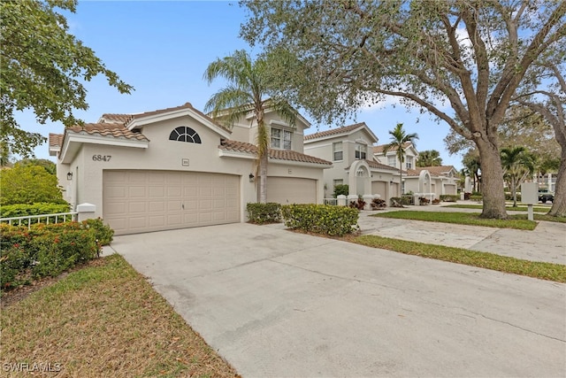 mediterranean / spanish-style home featuring a garage