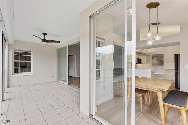 view of patio featuring ceiling fan