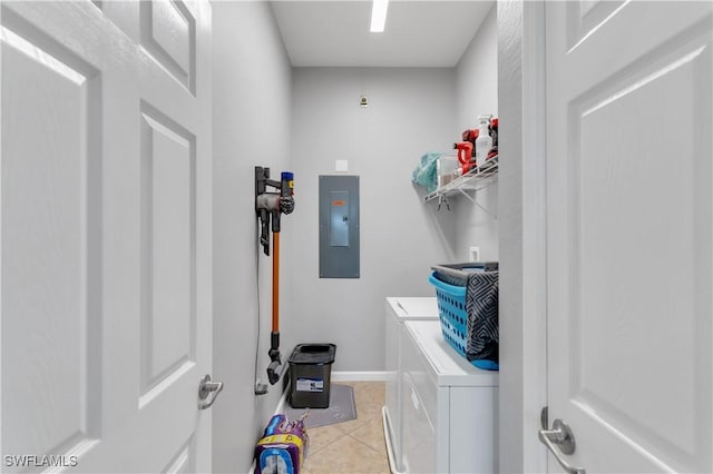 clothes washing area featuring electric panel, separate washer and dryer, and light tile patterned floors